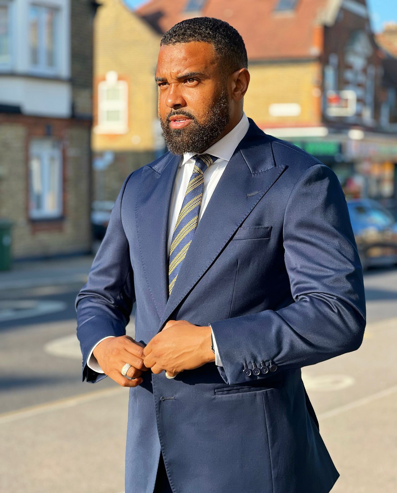Elegantia Ambitio client in a navy made-to-measure suit